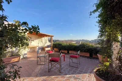 a group of chairs sitting on a patio at Beautiful Loft in Ponte Milvio with terrace in Rome