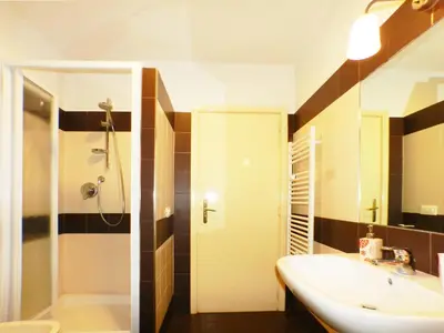 a bathroom with a sink and a shower at The Artist House in Rome