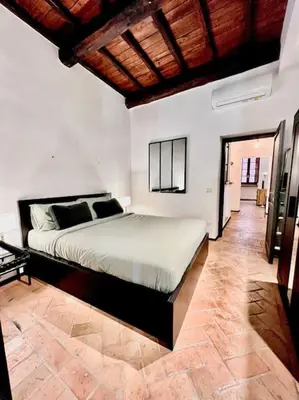 a bedroom with a large bed in a room at Appartamento nel cuore di Roma in Rome