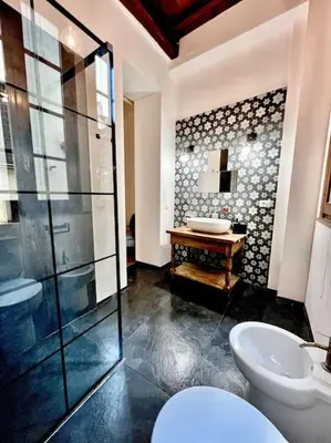 a bathroom with a shower and a toilet and a sink at Appartamento nel cuore di Roma in Rome