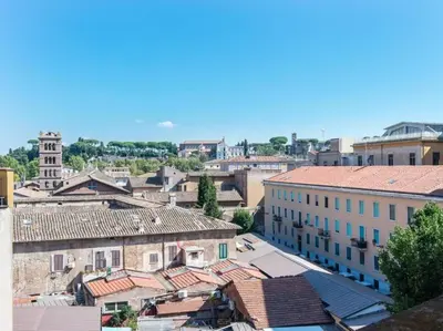 a view of a city with buildings and roofs at Panoramic Terrace Trastevere in Rome
