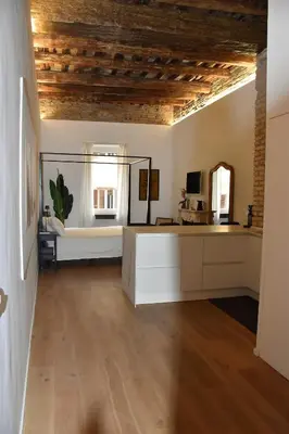 a large room with a bed and a mirror at Fontana Luxury Home in Rome
