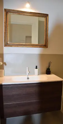 a bathroom with a sink and a mirror at Fontana Luxury Home in Rome