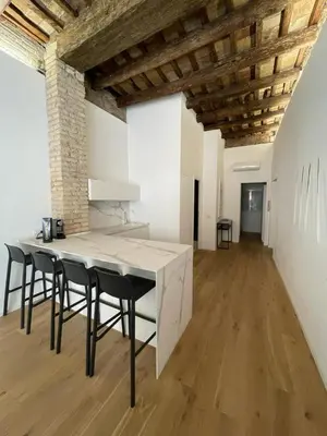 a kitchen with a table and chairs in a room at Fontana Luxury Home in Rome