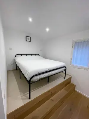 a bed sitting on top of a stair in a room at Fontana Luxury Home in Rome