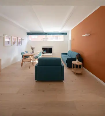 a living room with a couch and a table at Noah Charme in Rome