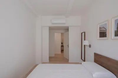 an empty hallway with white walls and a white floor at Matilda Charme in Rome