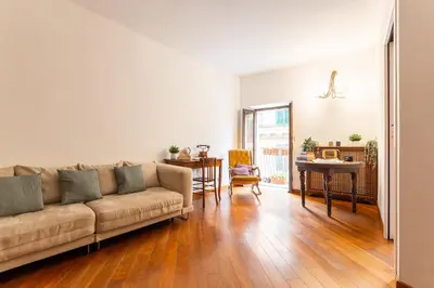 a living room with a couch and a table at Appartamento via di San Martino ai Monti in Rome