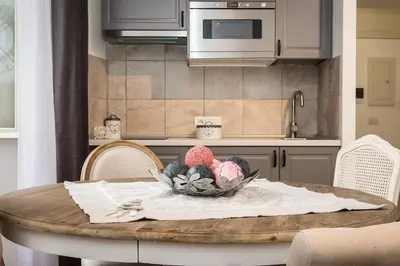 a kitchen with a table with a bowl of food on it at Navona Atmosphere A few meters from Piazza Navona !! in Rome