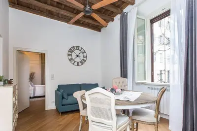 a dining room with a table and chairs at Navona Atmosphere A few meters from Piazza Navona !! in Rome