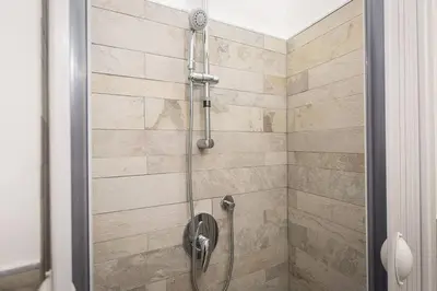 a shower with a glass door in a bathroom at Navona Atmosphere A few meters from Piazza Navona !! in Rome