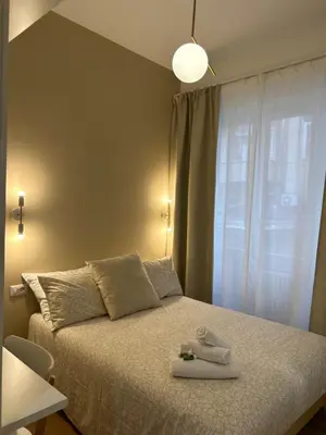 a bedroom with a bed and a window at IL NINFEO San Giovanni ROMA in Rome