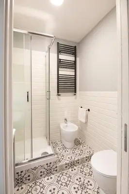 a bathroom with a shower and a toilet and a sink at Sofia’s home in Rome