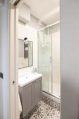 a bathroom with a sink and a shower at Sofia’s home in Rome