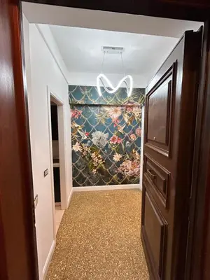 a hallway with a painting on the wall at Raffaello's Place in Rome
