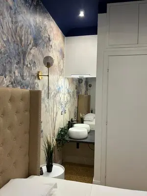 a bedroom with three sinks and a bed in a room at Raffaello's Place in Rome