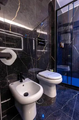 a bathroom with a toilet and a sink at Home at Rome Luxury Navona Guesthouse in Rome