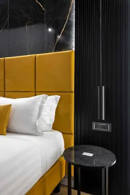 a hotel room with a bed and a table at Home at Rome Luxury Navona Guesthouse in Rome