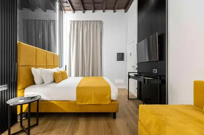 a hotel room with a bed and a television at Home at Rome Luxury Navona Guesthouse in Rome