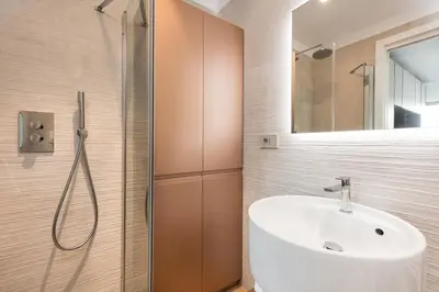 a bathroom with a sink and a shower at Idyllia - Lumina rooftop penthouse in Trastevere in Rome