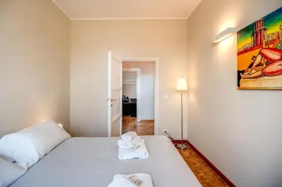 a bedroom with a bed with two towels on it at Borgo Vittorio 2 bdr 2 bath St Peter's in Rome
