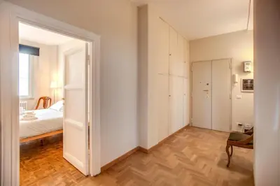 an empty room with a bedroom and a bed at Borgo Vittorio 2 bdr 2 bath St Peter's in Rome
