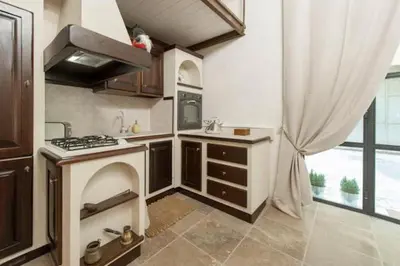 a kitchen with a stove and a sink in it at Shabby Loft in Colosseum in Rome
