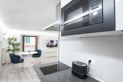 a living room with a tv on a wall at My Piazza Navona Jacuzzi Suite - Top Collection in Rome