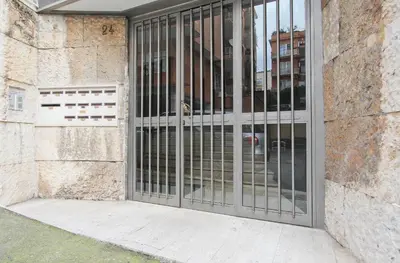 a door with metal bars on the side of a building at [Vaticano * * * * *] - Luxury Flat in Rome