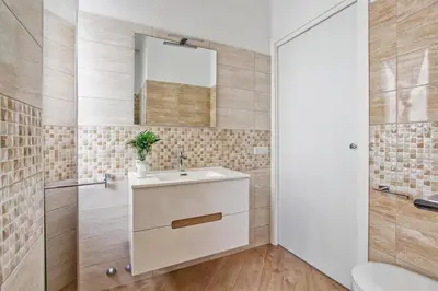 a bathroom with a sink and a mirror at [Vaticano * * * * *] - Luxury Flat in Rome