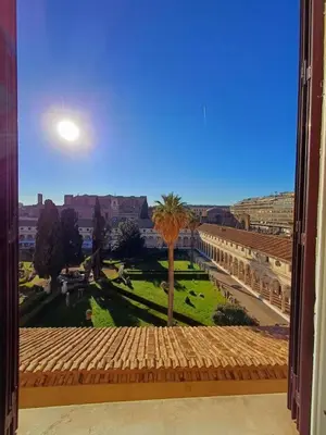 a room with a hallway with black cages in a building at MICHELANGELO SUITE ROMA GUEST HOUSE camere con vista sulle Terme di Diocleziano e sul Chiostro di Michelangelo in Rome