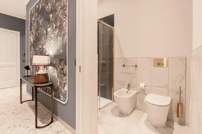 a bathroom with a toilet and a shower at Be Mate Castel Sant'Angelo in Rome