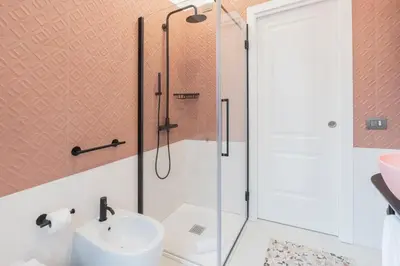 a bathroom with a shower and a toilet and a sink at Be Mate Trastevere I in Rome