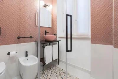 a bathroom with a toilet and a sink at Be Mate Trastevere I in Rome