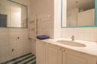 a bathroom with a sink and a mirror at Praty Rooms in Rome