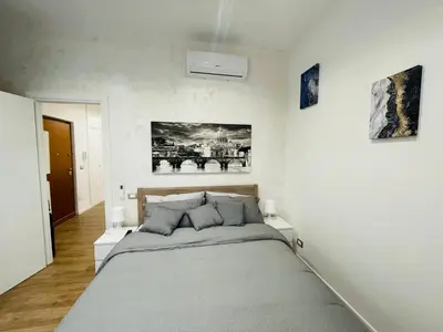 a bedroom with a large bed in a room at Home Vatican Oasis in Rome