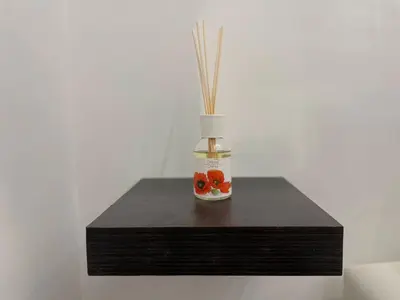 a bottle with fruit in it sitting on a table at Home Vatican Oasis in Rome