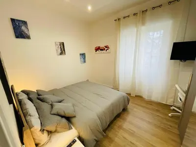 a bedroom with a bed in a room with a window at Home Vatican Oasis in Rome