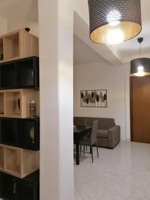 a living room with a table and a couch at Vatican Walls Apartment in Rome