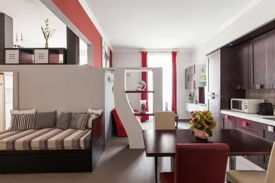 a living room with a couch and a table at Attic Vatican Flat - San Pietro in Rome