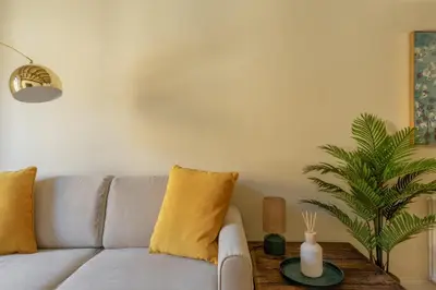 a living room with a couch and a table at iFlat The Heart of Monti in Rome