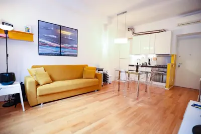 a living room with a couch and a table at New Apartment Vatican Museum in Rome
