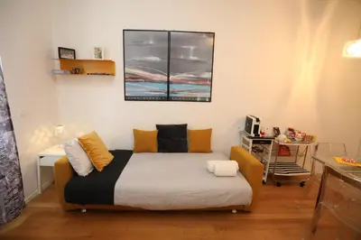 a small room with a bed and a window at New Apartment Vatican Museum in Rome