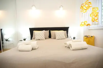 a bedroom with a large bed with four pillows at New Apartment Vatican Museum in Rome