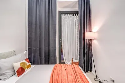 a bedroom with a bed and a window at Studio Artis Piazza di Spagna in Rome