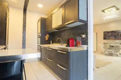 a kitchen with a sink and a counter at Cipro Roomy House - Vatican in Rome