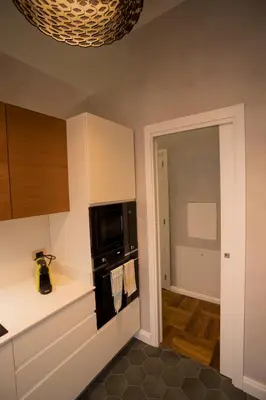 a kitchen with a stove and a microwave at FORNACI 48 GUEST HOUSE in Rome