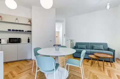 a living room with a table and chairs and a couch at Apt in the heart of the city in Rome