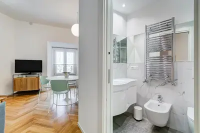 a white bathroom with a sink and a toilet at Apt in the heart of the city in Rome