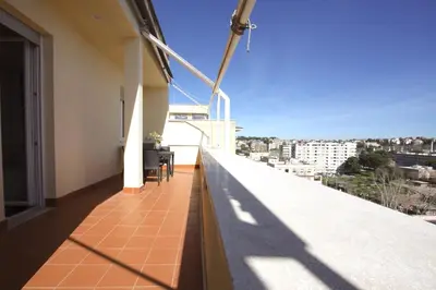 a balcony with a view of a city at Sunny Flaminio Terrace Penthouse in Rome
